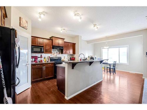 146 Bridlerange Place Sw, Calgary, AB - Indoor Photo Showing Kitchen