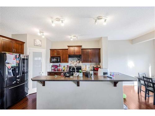 146 Bridlerange Place Sw, Calgary, AB - Indoor Photo Showing Kitchen