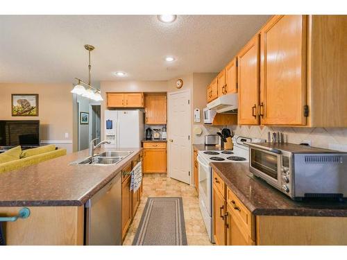 59 Coral Springs Boulevard Ne, Calgary, AB - Indoor Photo Showing Kitchen With Double Sink