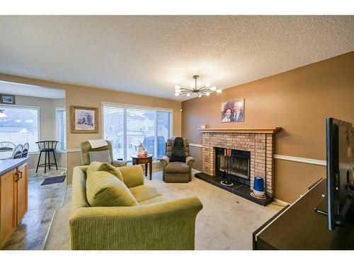 59 Coral Springs Boulevard Ne, Calgary, AB - Indoor Photo Showing Living Room With Fireplace