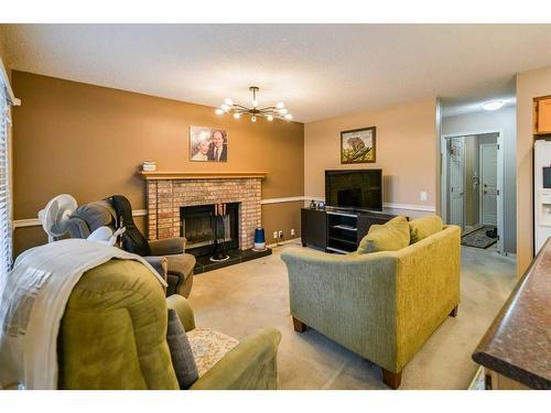 59 Coral Springs Boulevard Ne, Calgary, AB - Indoor Photo Showing Living Room With Fireplace