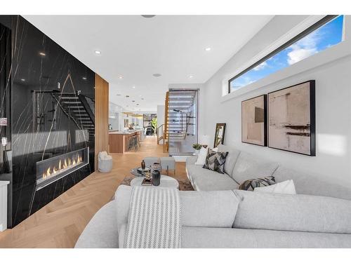 511 30 Street Nw, Calgary, AB - Indoor Photo Showing Living Room With Fireplace