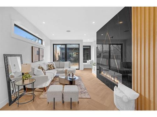 511 30 Street Nw, Calgary, AB - Indoor Photo Showing Living Room With Fireplace