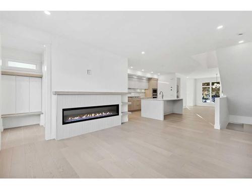 723 36 Street Nw, Calgary, AB - Indoor Photo Showing Living Room With Fireplace