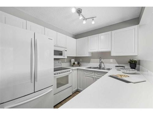 1308 154 Avenue Sw, Calgary, AB - Indoor Photo Showing Kitchen With Double Sink