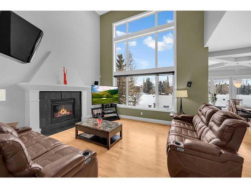 20 Lynx Meadows Court Nw, Calgary, AB - Indoor Photo Showing Living Room With Fireplace