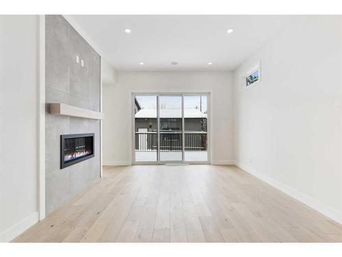 3536 7 Avenue Sw, Calgary, AB - Indoor Photo Showing Living Room With Fireplace