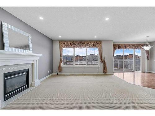 228 Taralake Terrace Ne, Calgary, AB - Indoor Photo Showing Living Room With Fireplace