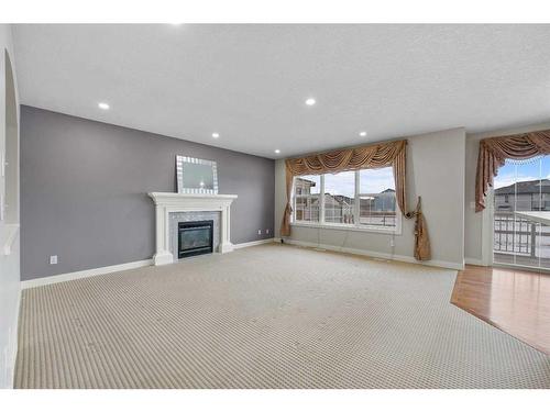 228 Taralake Terrace Ne, Calgary, AB - Indoor Photo Showing Living Room With Fireplace