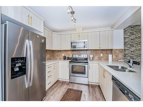 134 Cityscape Boulevard Ne, Calgary, AB - Indoor Photo Showing Kitchen With Double Sink