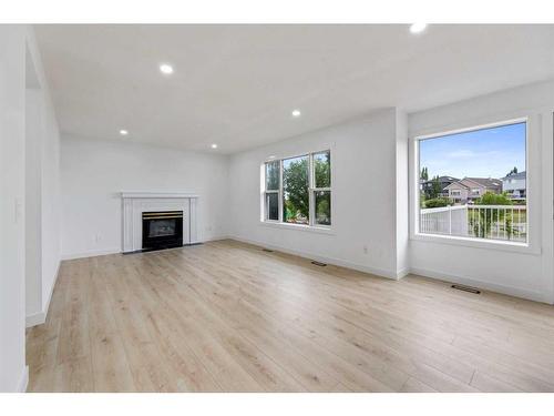 80 Sceptre Close Nw, Calgary, AB - Indoor Photo Showing Living Room With Fireplace