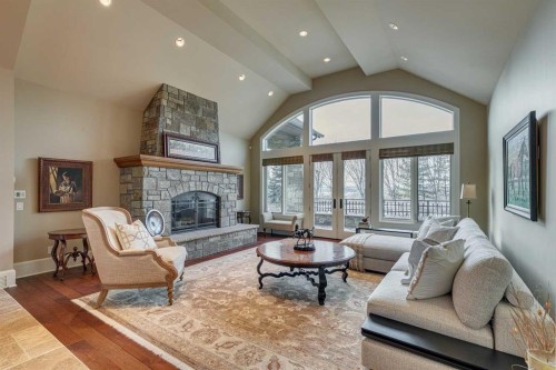 210070 85 Street West, Rural Foothills County, AB - Indoor Photo Showing Living Room With Fireplace