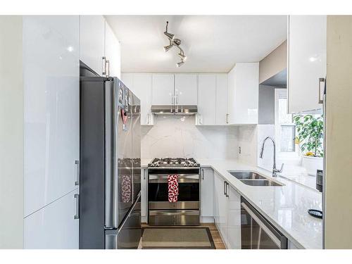 72 Deerpath Road Se, Calgary, AB - Indoor Photo Showing Kitchen With Double Sink With Upgraded Kitchen