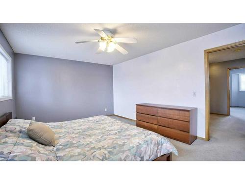 144 Mt Aberdeen Manor Se, Calgary, AB - Indoor Photo Showing Bedroom