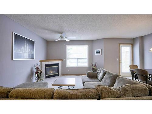 144 Mt Aberdeen Manor Se, Calgary, AB - Indoor Photo Showing Living Room With Fireplace