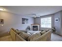 144 Mt Aberdeen Manor Se, Calgary, AB  - Indoor Photo Showing Living Room With Fireplace 