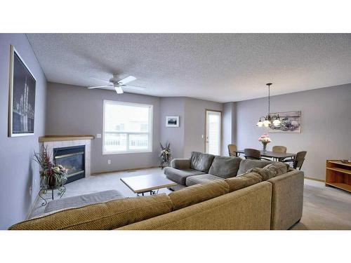 144 Mt Aberdeen Manor Se, Calgary, AB - Indoor Photo Showing Living Room With Fireplace