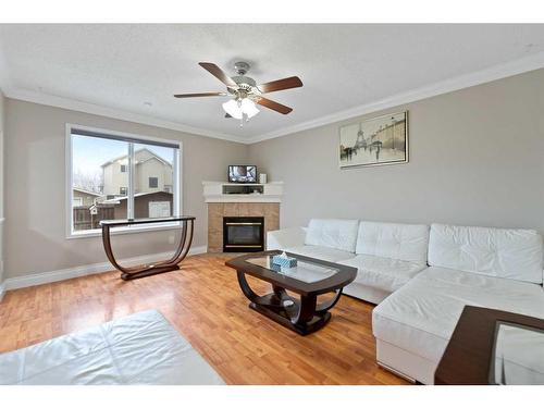 8255 Saddleridge Drive Ne, Calgary, AB - Indoor Photo Showing Living Room With Fireplace