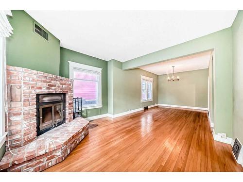 234 10A Street Nw, Calgary, AB - Indoor With Fireplace