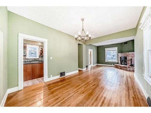 234 10A Street Nw, Calgary, AB - Indoor With Fireplace