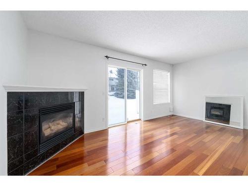 105 Somervale Park Sw, Calgary, AB - Indoor Photo Showing Living Room With Fireplace