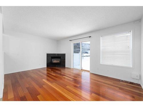 105 Somervale Park Sw, Calgary, AB - Indoor Photo Showing Living Room With Fireplace