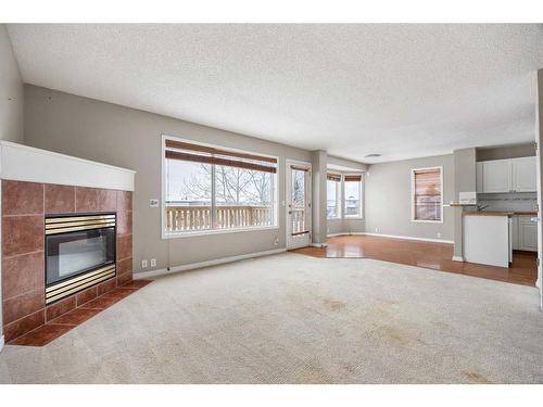 348 Harvest Lake Drive Ne, Calgary, AB - Indoor Photo Showing Living Room With Fireplace