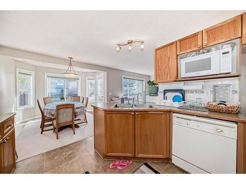 275 Taravista Street Ne, Calgary, AB - Indoor Photo Showing Kitchen With Double Sink