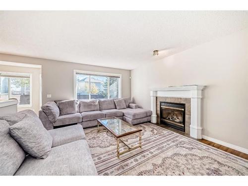 275 Taravista Street Ne, Calgary, AB - Indoor Photo Showing Living Room With Fireplace