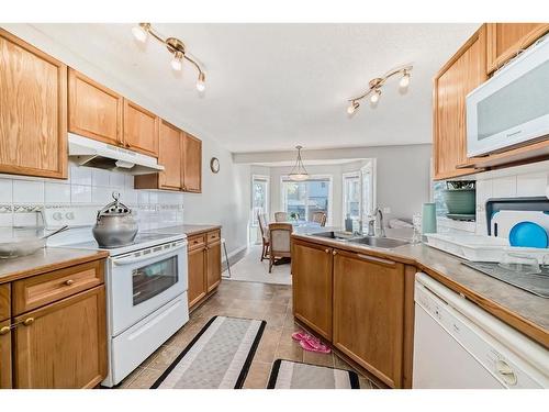 275 Taravista Street Ne, Calgary, AB - Indoor Photo Showing Kitchen With Double Sink