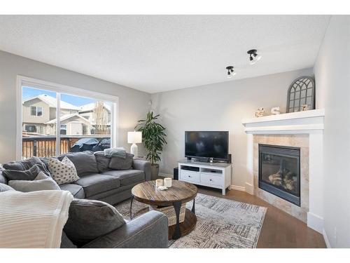 64 Brightonstone Gardens Se, Calgary, AB - Indoor Photo Showing Living Room With Fireplace