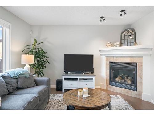 64 Brightonstone Gardens Se, Calgary, AB - Indoor Photo Showing Living Room With Fireplace