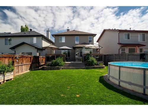 64 Brightonstone Gardens Se, Calgary, AB - Outdoor With Above Ground Pool With Backyard With Exterior