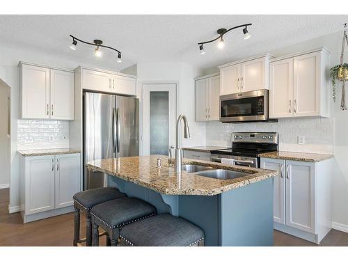 64 Brightonstone Gardens Se, Calgary, AB - Indoor Photo Showing Kitchen With Double Sink With Upgraded Kitchen