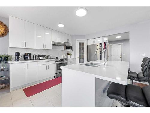 216 Tarawood Place Ne, Calgary, AB - Indoor Photo Showing Kitchen With Double Sink With Upgraded Kitchen