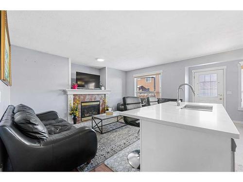 216 Tarawood Place Ne, Calgary, AB - Indoor Photo Showing Living Room With Fireplace