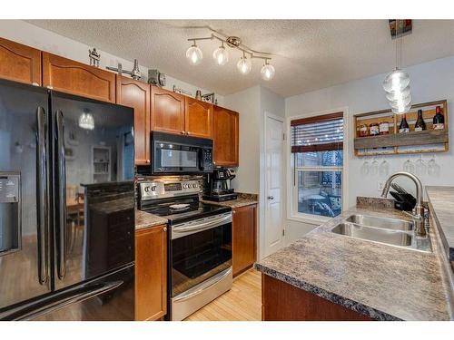 129 Elgin Place Se, Calgary, AB - Indoor Photo Showing Kitchen With Double Sink