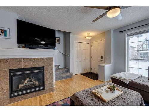 129 Elgin Place Se, Calgary, AB - Indoor Photo Showing Living Room With Fireplace