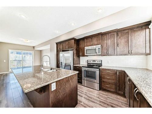 57 Nolanlake Cove Nw, Calgary, AB - Indoor Photo Showing Kitchen With Stainless Steel Kitchen With Double Sink With Upgraded Kitchen