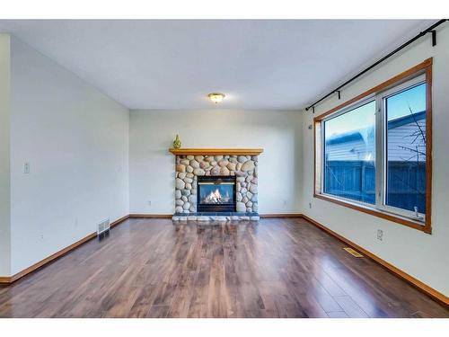 801 Martindale Boulevard Ne, Calgary, AB - Indoor Photo Showing Living Room With Fireplace