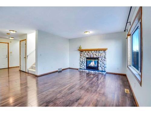 801 Martindale Boulevard Ne, Calgary, AB - Indoor Photo Showing Living Room With Fireplace