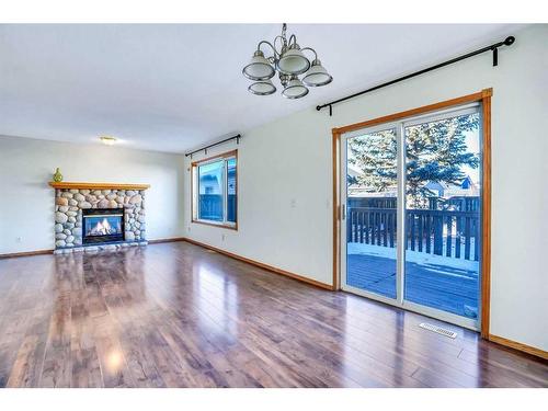 801 Martindale Boulevard Ne, Calgary, AB - Indoor Photo Showing Living Room With Fireplace