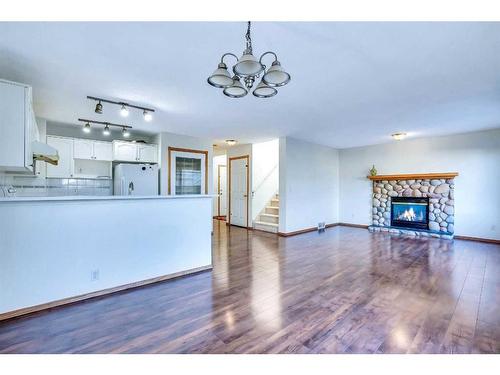 801 Martindale Boulevard Ne, Calgary, AB - Indoor Photo Showing Living Room With Fireplace