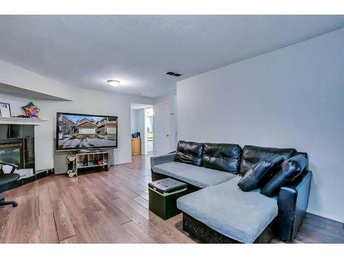 801 Martindale Boulevard Ne, Calgary, AB - Indoor Photo Showing Living Room With Fireplace