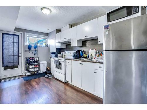 54 Taracove Road Ne, Calgary, AB - Indoor Photo Showing Kitchen With Double Sink