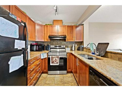 82 Panatella Villas Nw, Calgary, AB - Indoor Photo Showing Kitchen With Double Sink