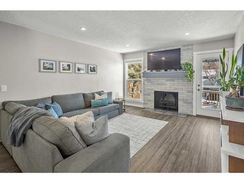 13128 6 Street Sw, Calgary, AB - Indoor Photo Showing Living Room With Fireplace