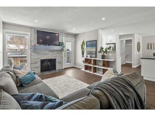 13128 6 Street Sw, Calgary, AB - Indoor Photo Showing Living Room With Fireplace