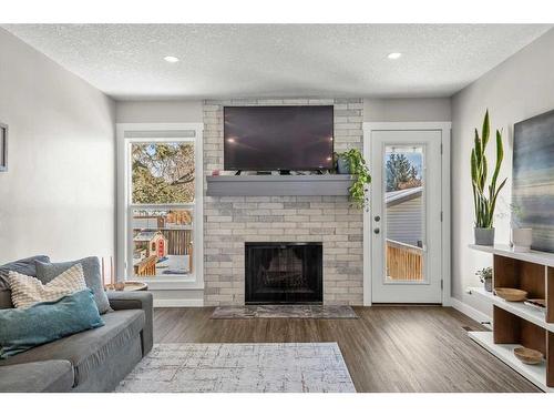 13128 6 Street Sw, Calgary, AB - Indoor Photo Showing Living Room With Fireplace