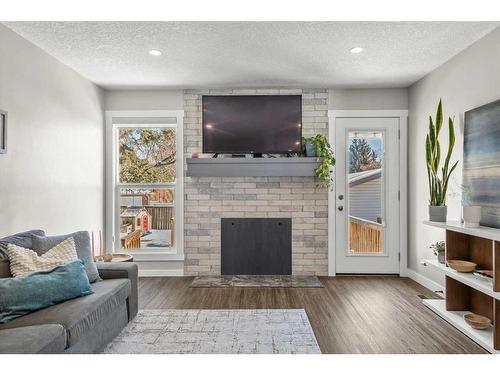 13128 6 Street Sw, Calgary, AB - Indoor Photo Showing Living Room With Fireplace